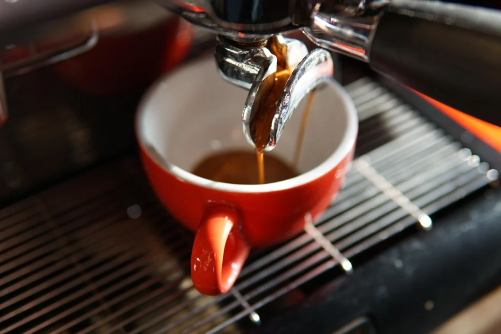 Espresso shot pouring from portafilter